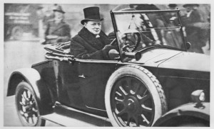 Driving what appears to be a Wolseley, Birdcage Walk, Westminster, 1925. (Churchill was then Chancellor of the Exchequer.) Note the ding in the right front fender!